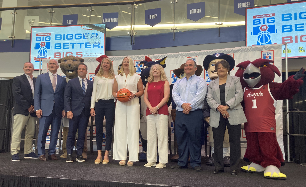 Coaches and officials pose for a photo following Thursday's press conference announcing changes to the Big 5.